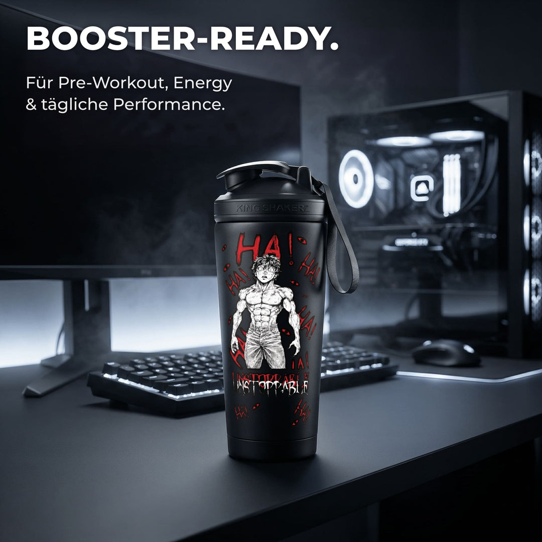 KING SHAKER® UNSTOPPABLE – schwarzer Edelstahl-Shaker mit Farbdruck, am Schreibtisch mit Booster